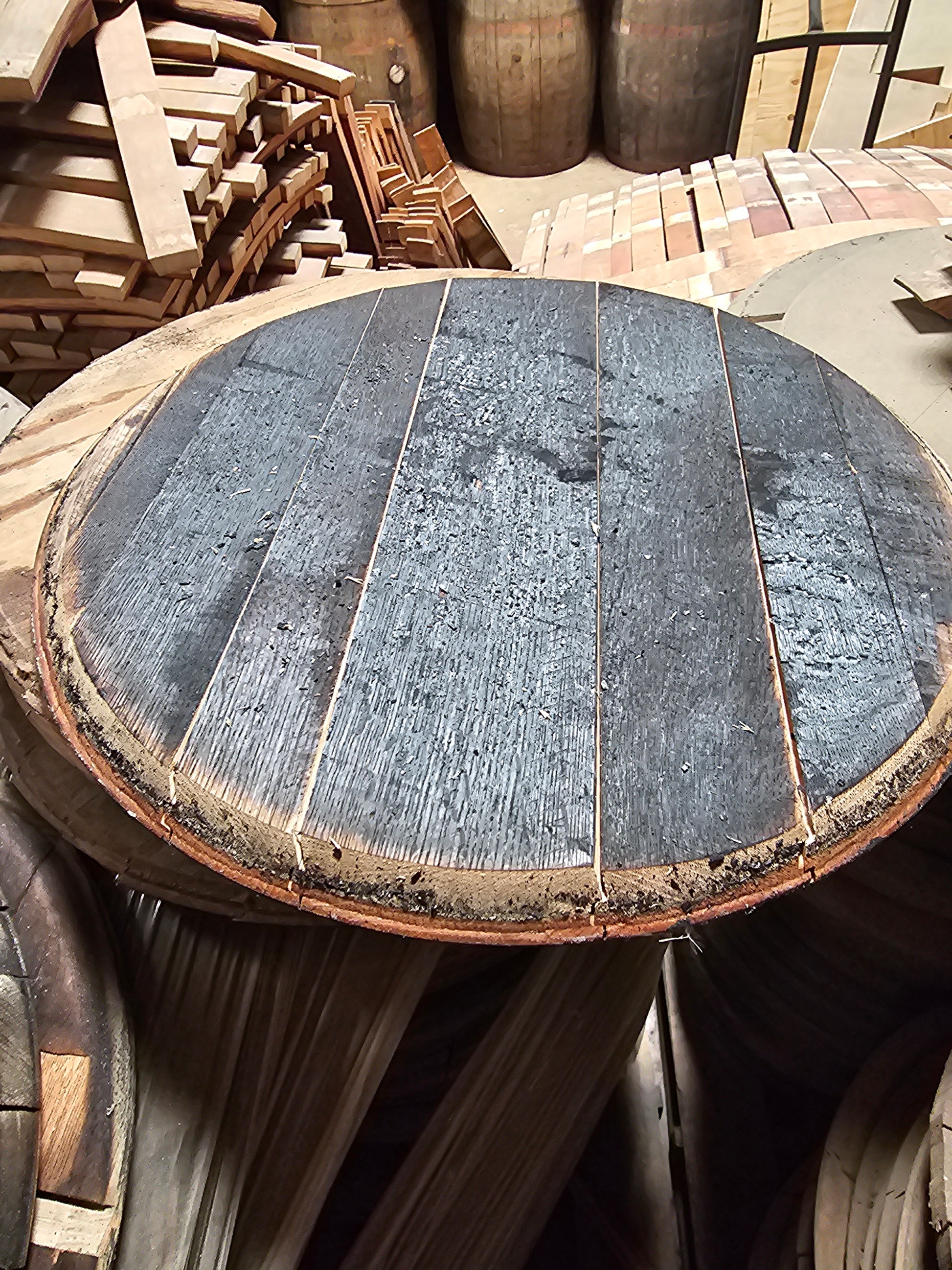 whiskey barrel head with staves in background