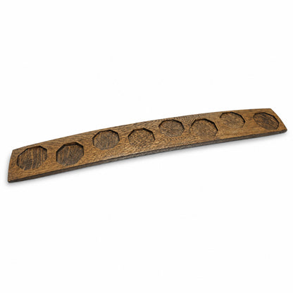 Dark walnut reclaimed oak bourbon barrel stave with eight routed bottle recesses.