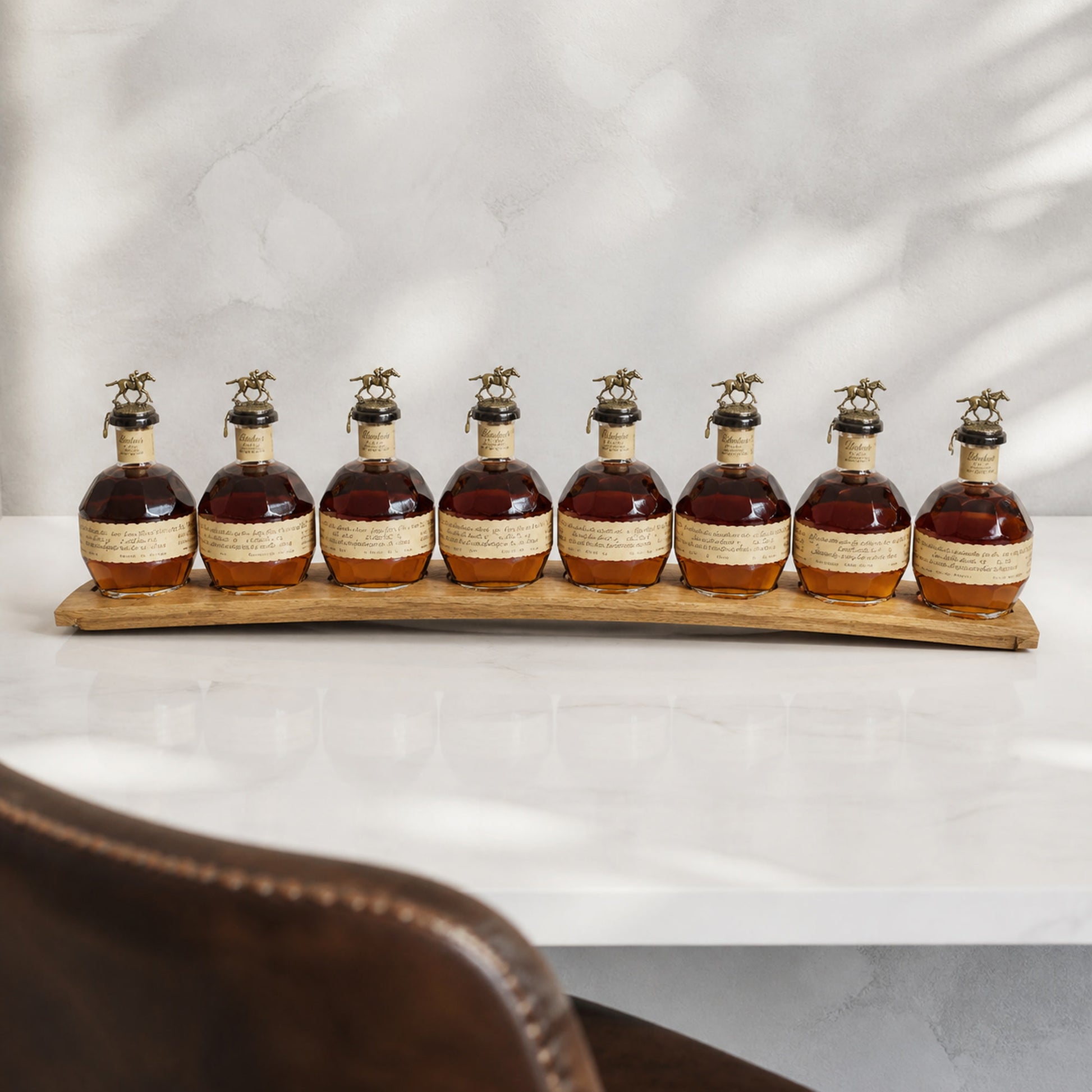 Natural oak barrel stave display holding eight bourbon bottles; bottles not included.