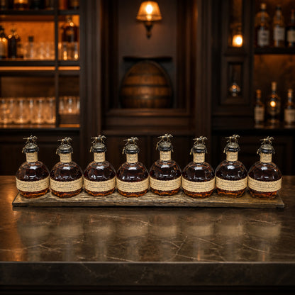 Dark walnut barrel stave display holding eight bourbon bottles in a home bar; bottles not included.