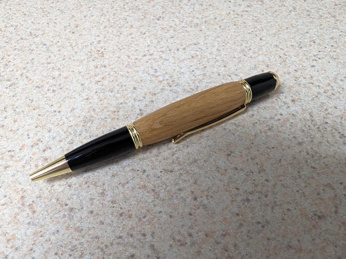 24K Gold Wall Street executive pen handcrafted with whiskey barrel wood and gold accents