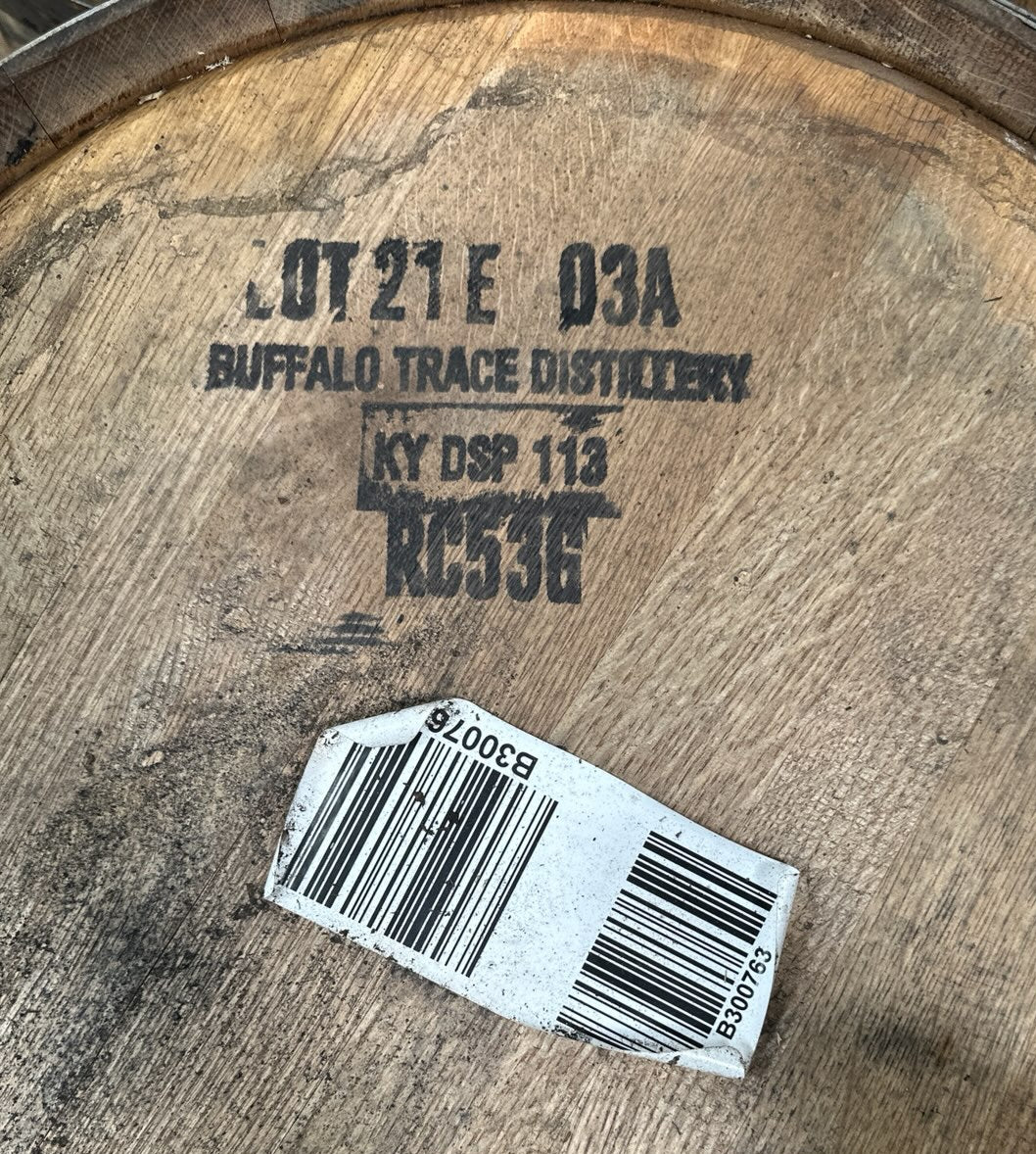 Wooden barrel with 'Buffalo Trace Distillery' branding and a barcode label.
