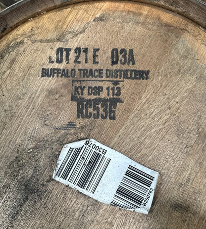 Wooden barrel with 'Buffalo Trace Distillery' branding and a barcode label.