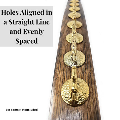 8 holes aligned in a straight line and evenly spaced for Blanton's stoppers