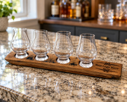 Personalized four-glass whiskey flight on a sunny kitchen counter.