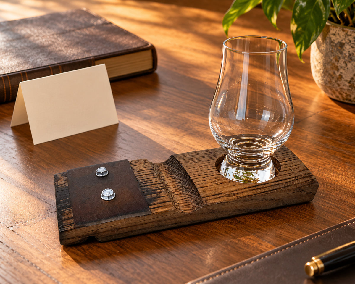 Glencairn glass on the reclaimed oak holder beside a blank gift card and a book.