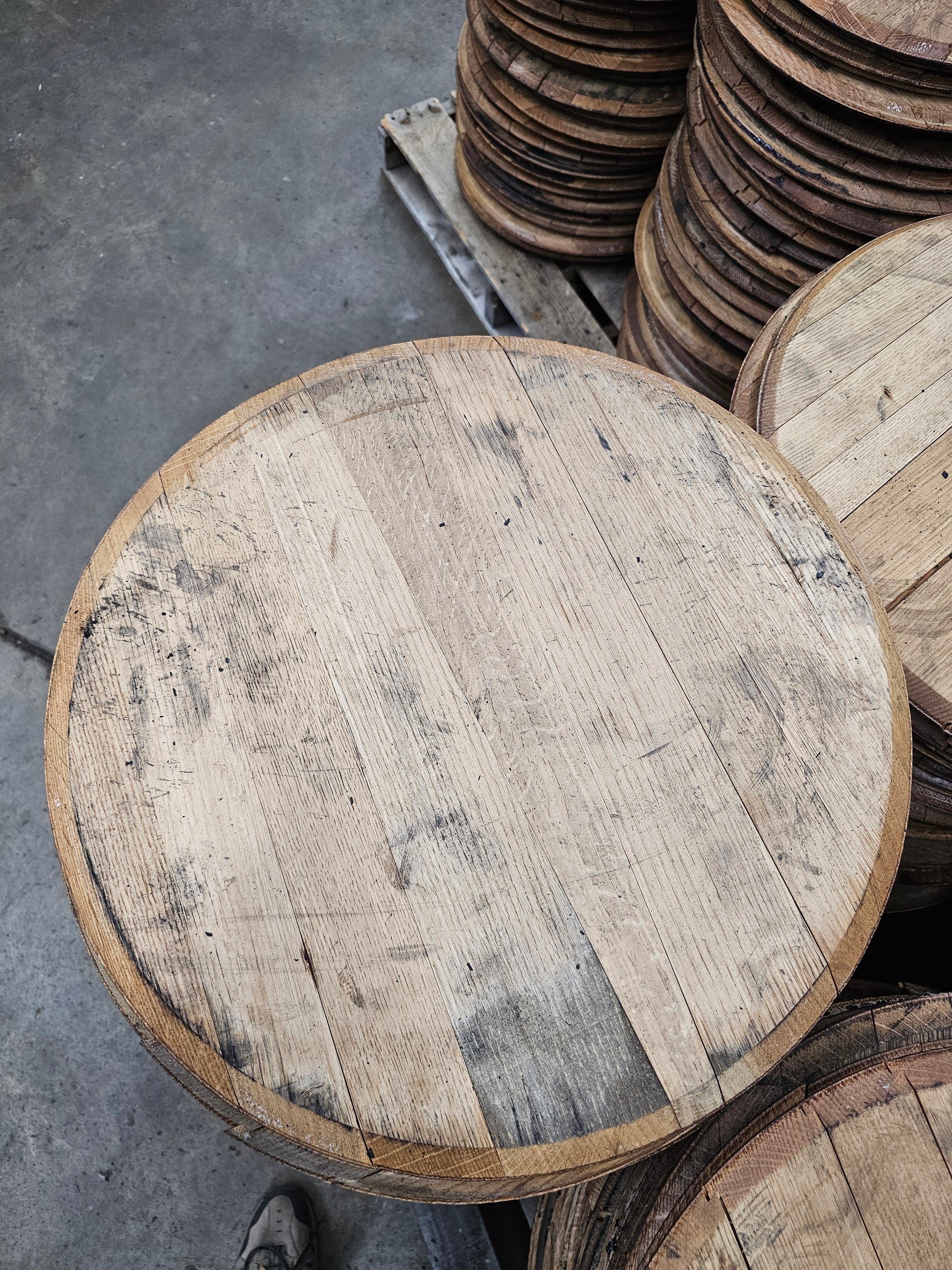 Authentic unstamped Buffalo Trace bourbon barrel head showing reclaimed oak grain and tongue-and-groove staves.