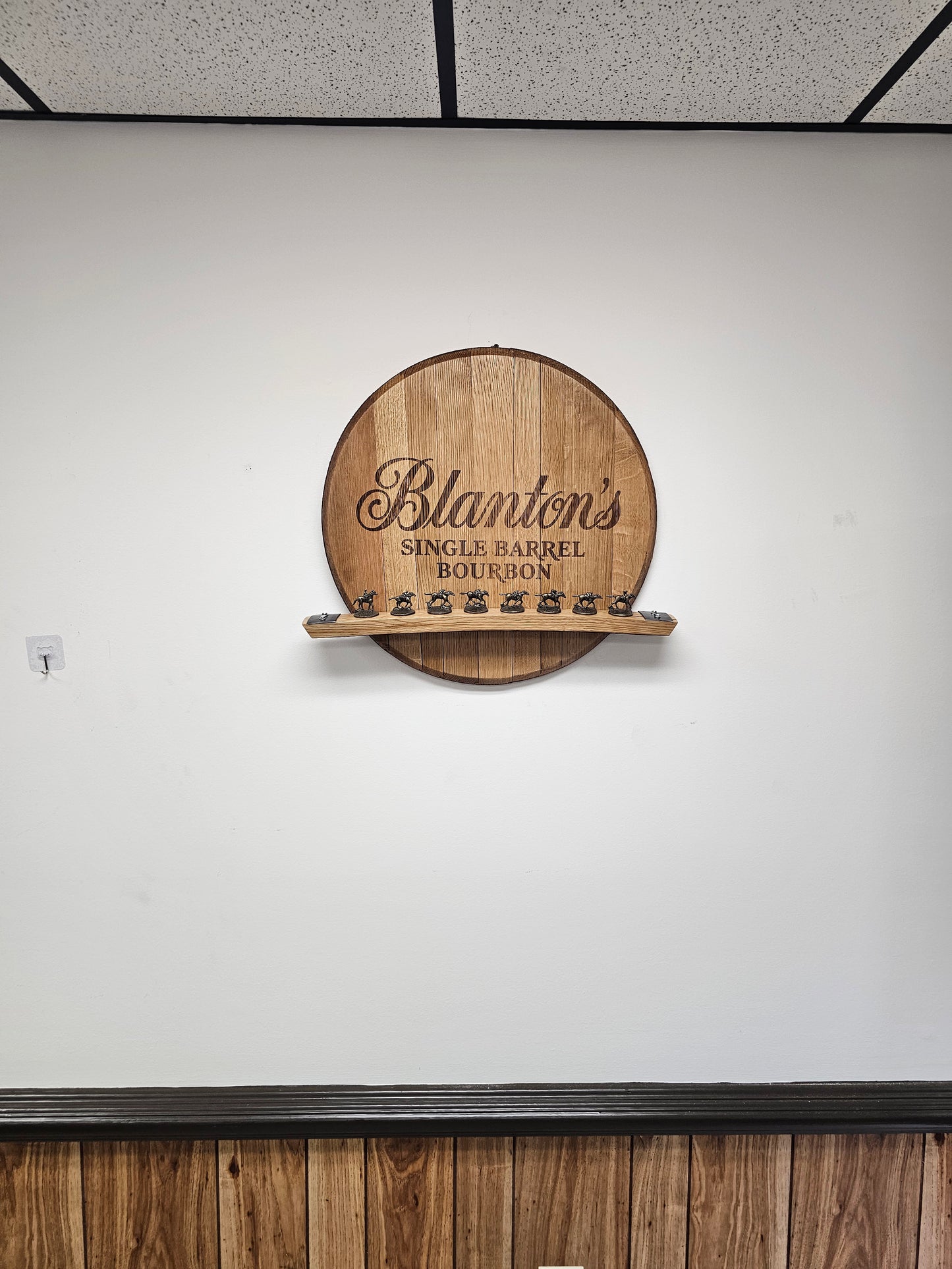 Wall-mounted Blanton's barrel head display shown for scale; horse stoppers are not included.