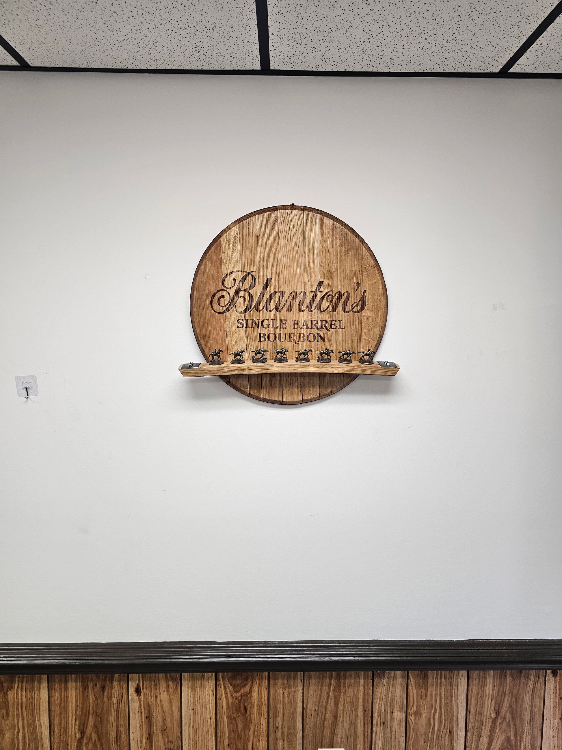 Wall-mounted Blanton's barrel head display shown for scale; horse stoppers are not included.