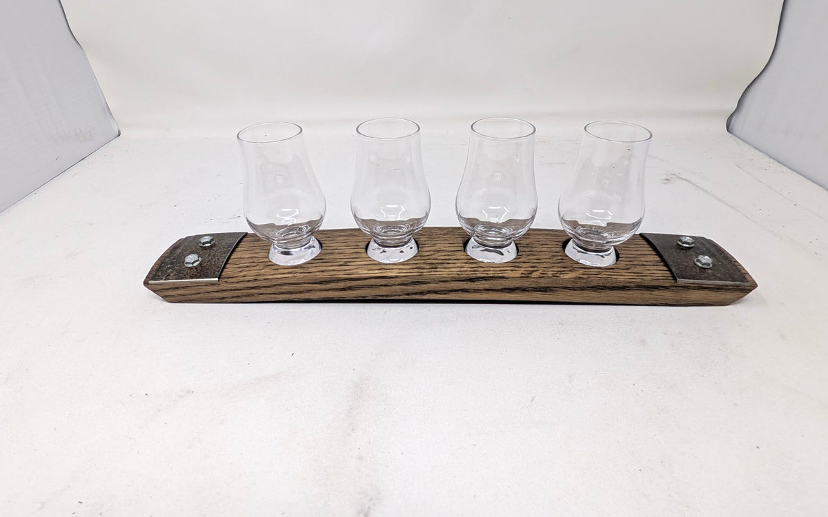 Mini premium four-glass whiskey flight with Wee Glencairn glasses on reclaimed barrel stave